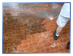 Cleaning of paving slabs with application of protective coating